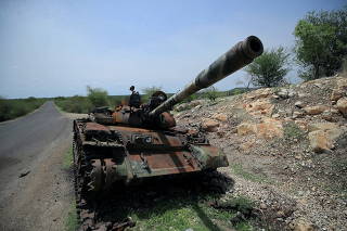 FILE PHOTO: A tank damaged during the fighting between Ethiopia?s National Defense Force (ENDF) and Tigray Special Force stands on the outskirts of Humera town