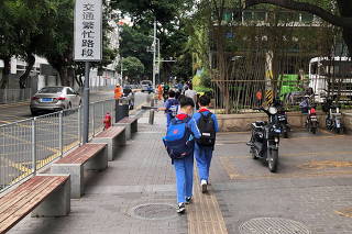 FILE PHOTO: Children leave a school in Shekou area of Shenzhen, China