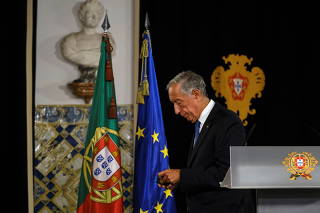 Portugal's President Marcelo Rebelo de Sousa leaves after announcing his decision to dissolve parliament triggering snap general elections, in Belem Palace, in Lisbon