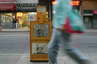 A long-exposure photograph shows a newspaper box with The New York Sun outside their office in Lower Manhattan on Monday, Sept. 29, 2008, the year it stopped publishing print editions. (Hiroko Masuike/The New York Times)