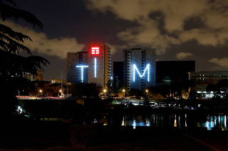 FILE PHOTO: Telecom Italia's logo for the TIM brand is seen on a building in Rome