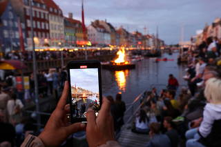 Midsummer solstice celebration in Copenhagen's famous Nyhaven
