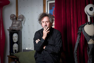 Tim Burton at his studio, beside Jack Skellington, a character from 