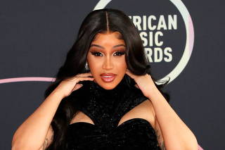 Show host Cardi B poses at a photo op ahead of the 49th Annual American Music Awards in Los Angeles