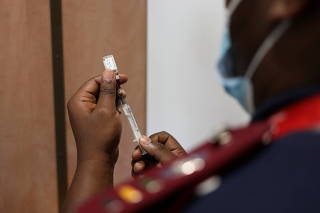 FILE PHOTO: A nurse prepares a dose of the of coronavirus disease (COVID-19) in Dutywa