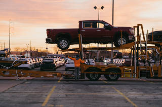 The Jack Cooper Transport lot in Kansas City, Kansas, a way station for many vehicles built at a General Motors plant next door and elsewhere, Nov. 30, 2021. (Chase Castor/The New York Times)