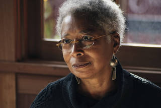 Alice Walker talks over a lunch with Colm Toibin, a fellow author, at Chez Panisse in Berkeley, Calif.