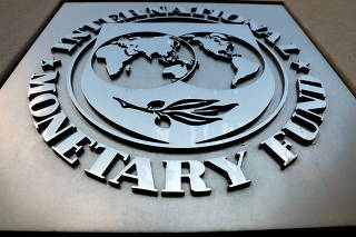 FILE PHOTO: The IMF logo is seen outside the headquarters building in Washington