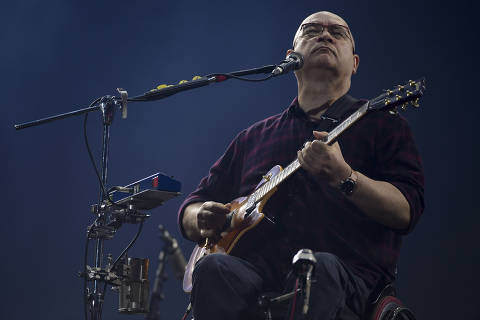 Brazilian musician Herbert Vianna, of rock band Paralamas do Sucesso, performs during the last day of the Rock in Rio music festival at the Olympic Park in Rio de Janeiro, Brazil, on October 6, 2019. - The week-long Rock in Rio festival started September 27, with international stars as headliners, over 700,000 spectators and social actions including the preservation of the Amazon. (Photo by Mauro PIMENTEL / AFP)