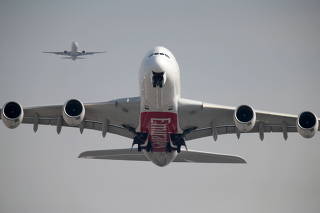 FILE PHOTO: An Emirates Airline Airbus A380 plane takes off from Dubai International Airport in Dubai