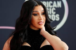 Show host Cardi B poses at a photo op ahead of the 49th Annual American Music Awards in Los Angeles