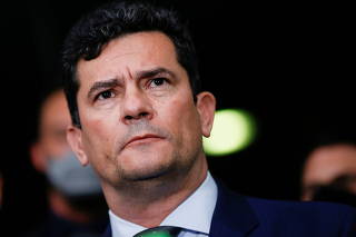 Former Brazil's Justice Minister Sergio Moro looks on during a news conference after a meeting with senators at the Brazilian Federal Senate in Brasilia