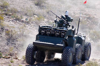 A photo provided by Defense Advanced Research Projects Agency/Carnegie Mellon of a combat robotic vehicle at the White Sands Missile Range in New Mexico in 2008. (Defense Advanced Research Projects Agency/Carnegie Mellon via The New York Times)