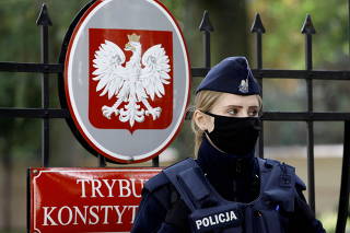 FILE PHOTO: Police officer stands outside Constitutional Tribunal building in Warsaw