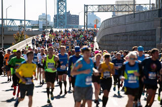 Runners competing in the New York City Marathon on Nov. 4, 2018, cross the Willis Avenue Bridge to enter the Bronx.
