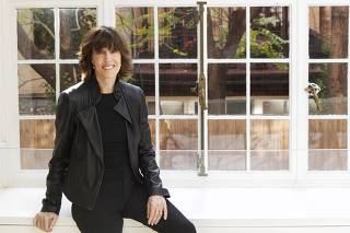 File photo of Nora Ephron posing for a portrait in her home in New York