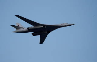 FILE PHOTO: Russian Tu-160 Supersonic Bomber flies during a military parade marking the Belarus Independence Day in Minsk