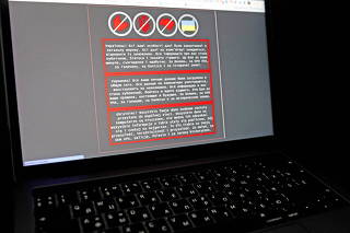 FILE PHOTO: A laptop screen displays a warning message on the official website of the Ukrainian Foreign Ministry, in this illustration