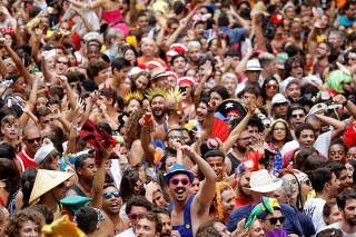FILE PHOTO: Revellers take part in the annual block party known as 