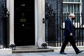 FILE PHOTO: British Prime Minister Johnson walks outside Downing Street in London