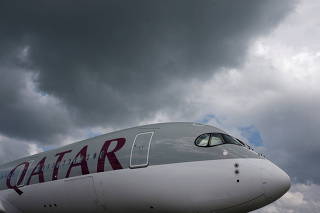 FILE PHOTO: A Qatar Airways Airbus A350 XWB aircraft is displayed at the Singapore Airshow at Changi Exhibition Center