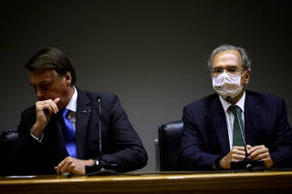 Brazil's President Bolsonaro and Economy Minister Guedes attend a news conference in Brasilia