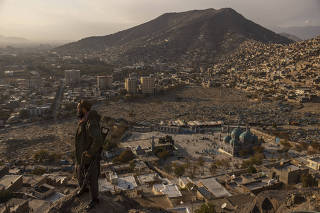 Hekmatullah Sahel, a Talib assigned to KabulÕs Police District 3, in the hills above the Sakhi Shah-e Mardan shrine and mosque, which his unit is charged with protecting, on Nov. 6, 2021. (Victor J. Blue/The New York Times)