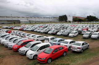 FILE PHOTO: New cars are parked at a stock area of German automaker Volkswagen's plant in Taubate