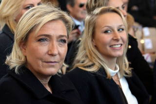 FILE PHOTO: French National Front political party leader Marine Le Pen and politician Marion Marechal-Le Pen attend a ceremony in tribute to the victims and the families of the fatal truck attack three months ago, in NIce