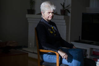 Cindy Myers of Petaluma, Calif., an executive in the Bay Area, sits for a portrait on Feb. 2, 2022. She has been working from home for two years, and the change has taken a physical and mental toll, she said. (Bryan Meltz/The New York Times)