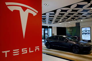 FILE PHOTO: A Tesla model 3 car is seen in their showroom in Singapore