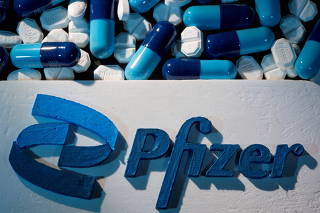 FILE PHOTO: 3D printed Pfizer logo is placed near medicines from the same manufacturer in this illustration