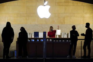 Apple employees work in Apple Store at Grand Central Terminal, New York City