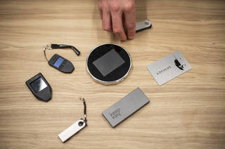 A variety of cryptocurrency hardware wallets used for storage, in New York, Jan. 26, 2022. (Joshua Bright/The New York Times)