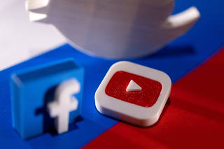 FILE PHOTO: Illustration shows Twitter, Facebook and Youtube logos and Russian flag
