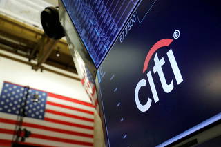 FILE PHOTO: The logo for Citibank is seen on the trading floor at the New York Stock Exchange (NYSE) in Manhattan, New York City