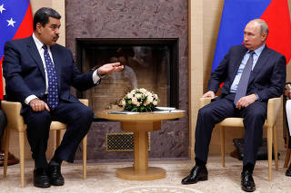 FILE PHOTO: Russian President Putin meets with his Venezuelan counterpart Maduro outside Moscow