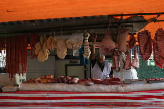 A vendor looks on at a weekly street market in Rio de Janeiro