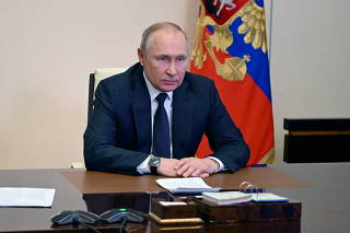 FILE PHOTO: Russian President Putin chairs a meeting with members of the Security Council outside Moscow