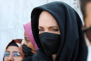UNHCR special envoy Angelina Jolie stands during a visit to a camp for people displaced by war, in the southern province of Lahej