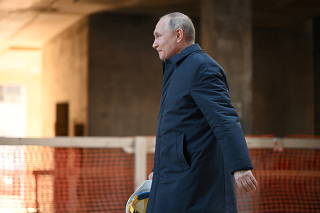 FILE PHOTO: Russian President Vladimir Putin visits the construction site of the National Space Agency in Moscow