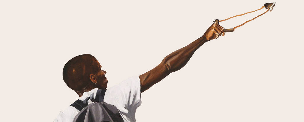 jovem negro lança uma pedra com seu estilingue