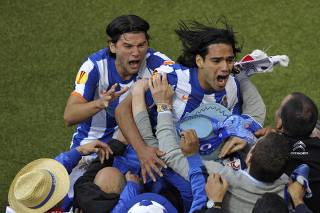 Porto's Falcao and Sapunaru celebrate a goal against Braga during their Europa League final soccer match in Dublin