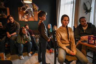 Russians who fled to Turkey at the apartment of a volunteer in Istanbul, March 12, 2022. (The New York Times)