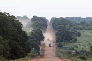 Trucks travel on the MT-100 highway which past through the Maraiwatsede indigenous reserve in Mato Grosso