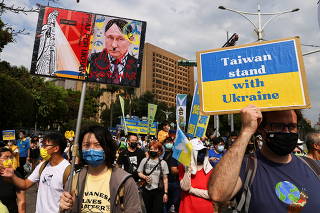 People attend a rally against Russia's invasion of Ukraine in Taipei