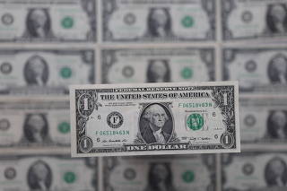 Illustration shows U.S. dollar banknotes