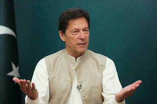FILE PHOTO: Pakistan's Prime Minister Imran Khan gestures during an interview with Reuters, in Islamabad