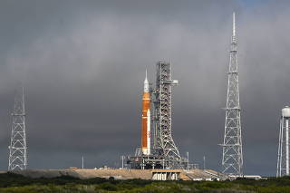 Morning fog lifts as NASA?s next-generation moon rocket, the Space Launch System (SLS) rocket sits at launch pad 39-B