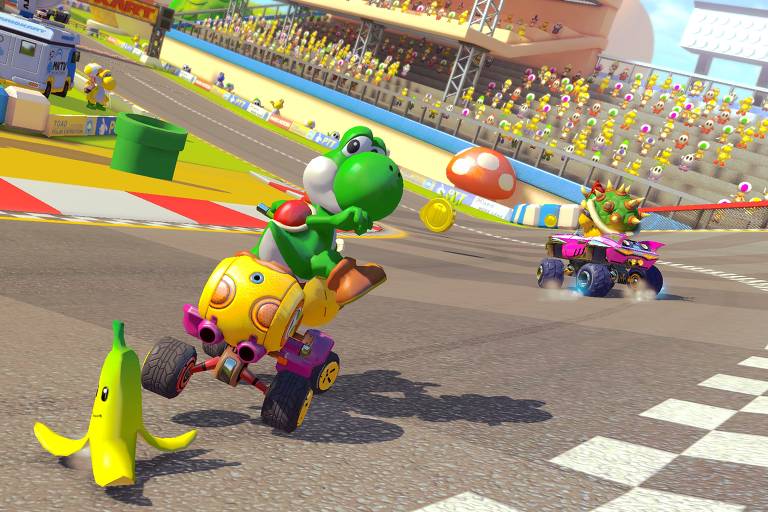 Yoshi solta uma casca de banana sentado em um kart durante uma corrida no jogo "Mario Kart 8 Deluxe" para Switch